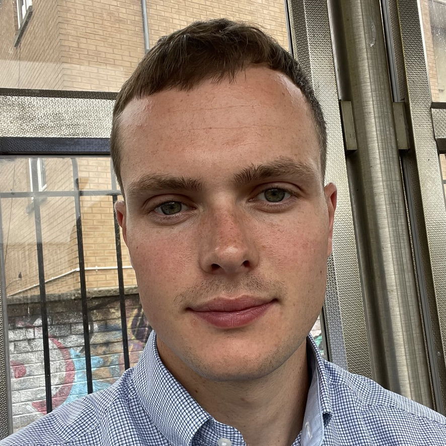 Picture of Aaron - a man with short hair in an a collared work shirt